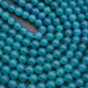 Close-up of blue beads on a dark background