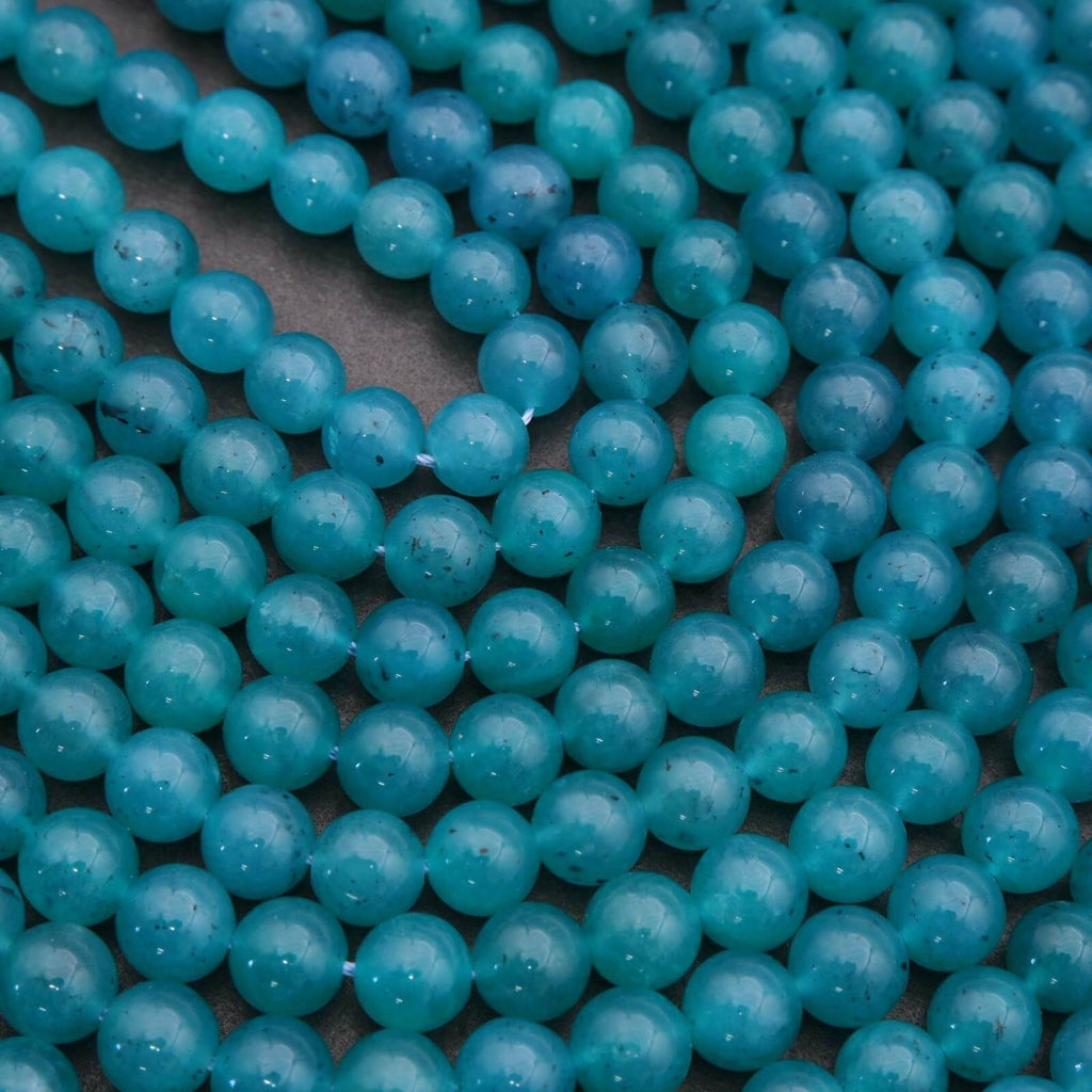 Close-up of blue beads on a dark background