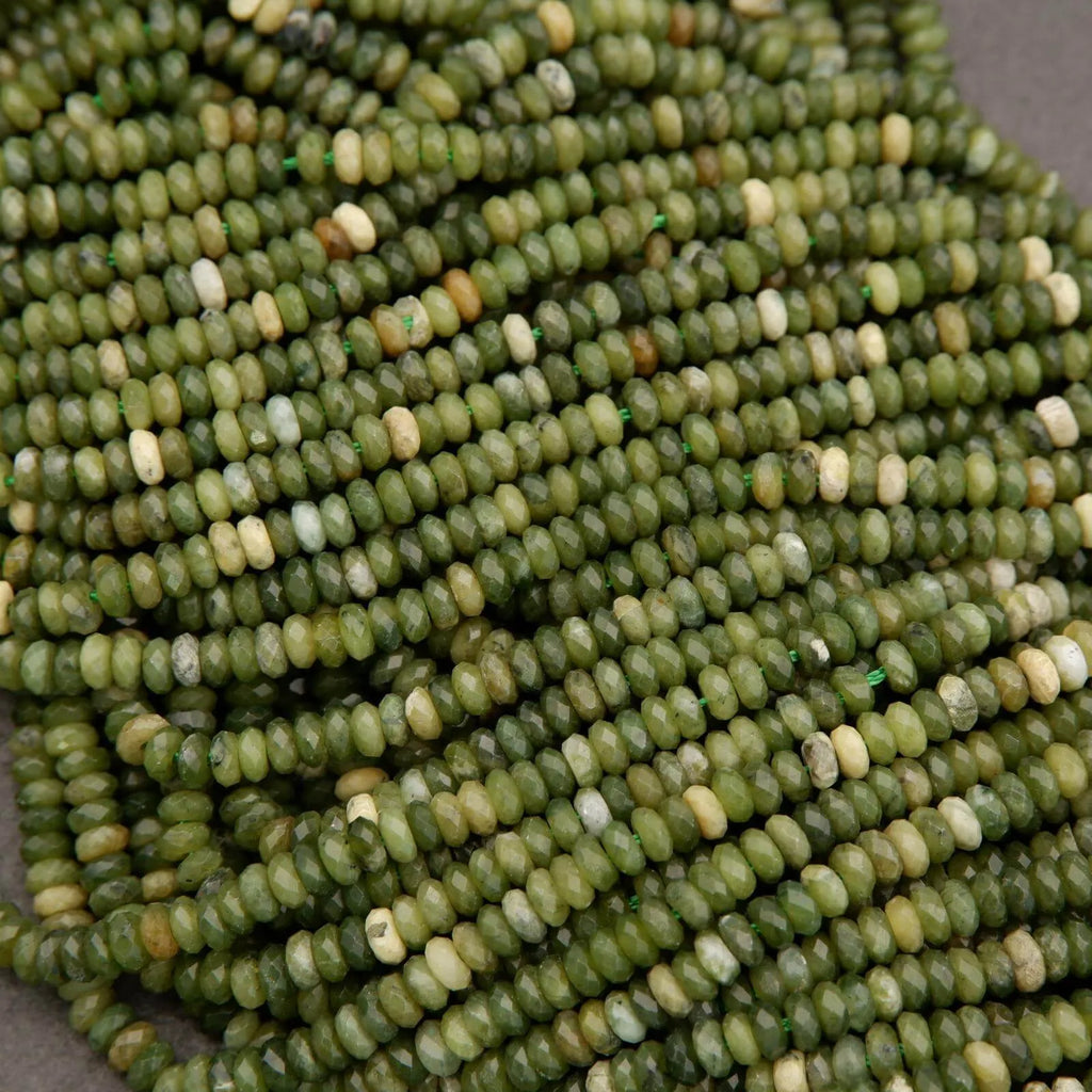 Close-up of green glass beads on a gray background