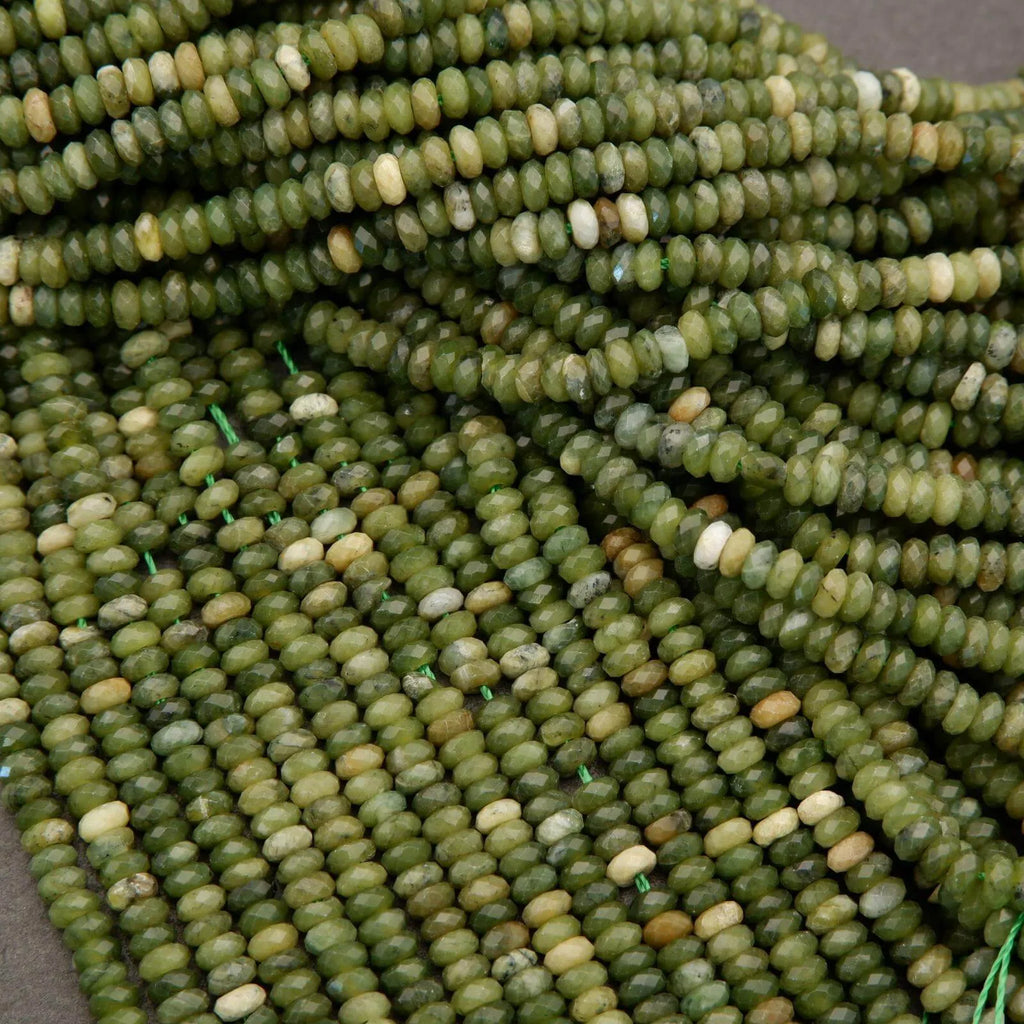 Close-up of green glass beads on a gray background