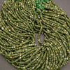 String of green beads on a gray background