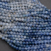 Close-up of blue beads on a dark surface