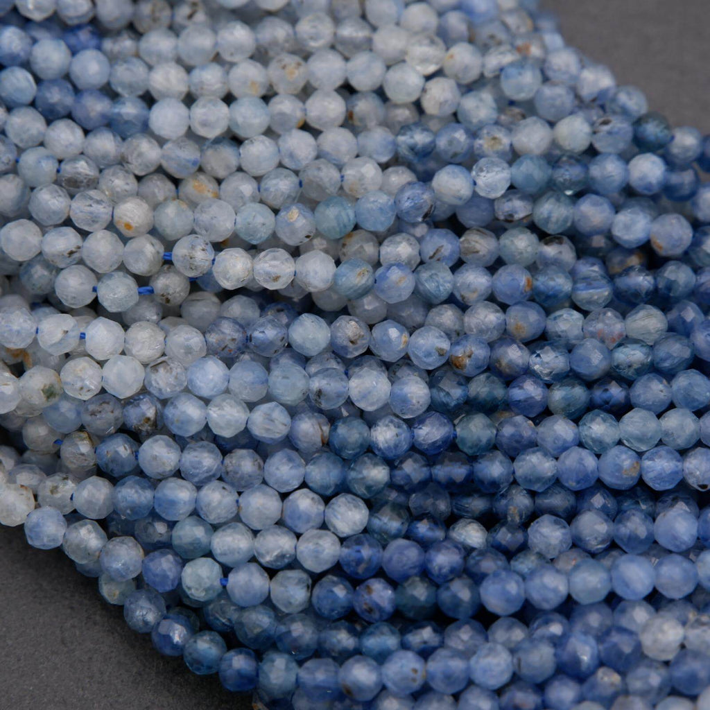 Close-up of blue beads on a dark surface