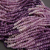 Close-up of purple and pink beads on a dark background
