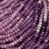 Close-up of purple beads on a white background
