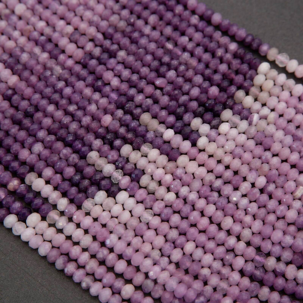 Close-up of purple and pink beads on a dark background