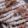 Close-up of a pile of pink and white beads