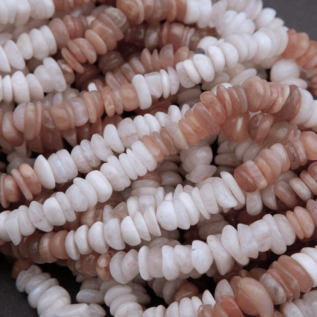 Close-up of a pile of pink and white beads