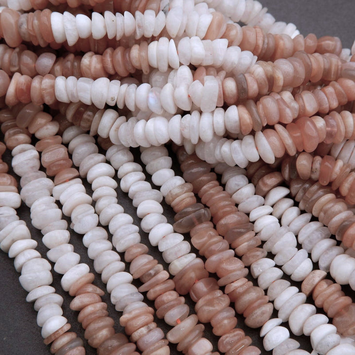Close-up of multicolored stone beads on a dark surface