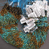 Multicolor blue and brown strands of round beads.