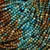 Multicolor blue and brown strands of round beads.
