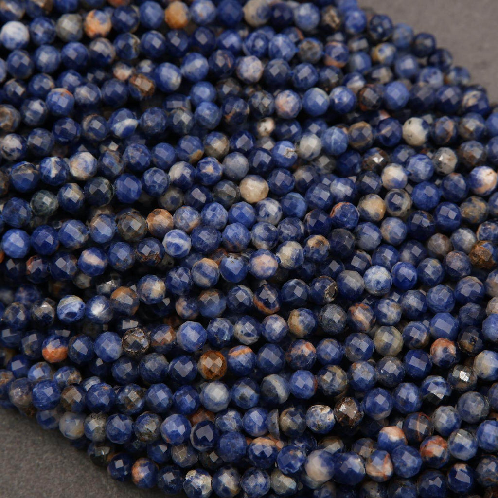 Close-up of blue faceted beads on a gray surface