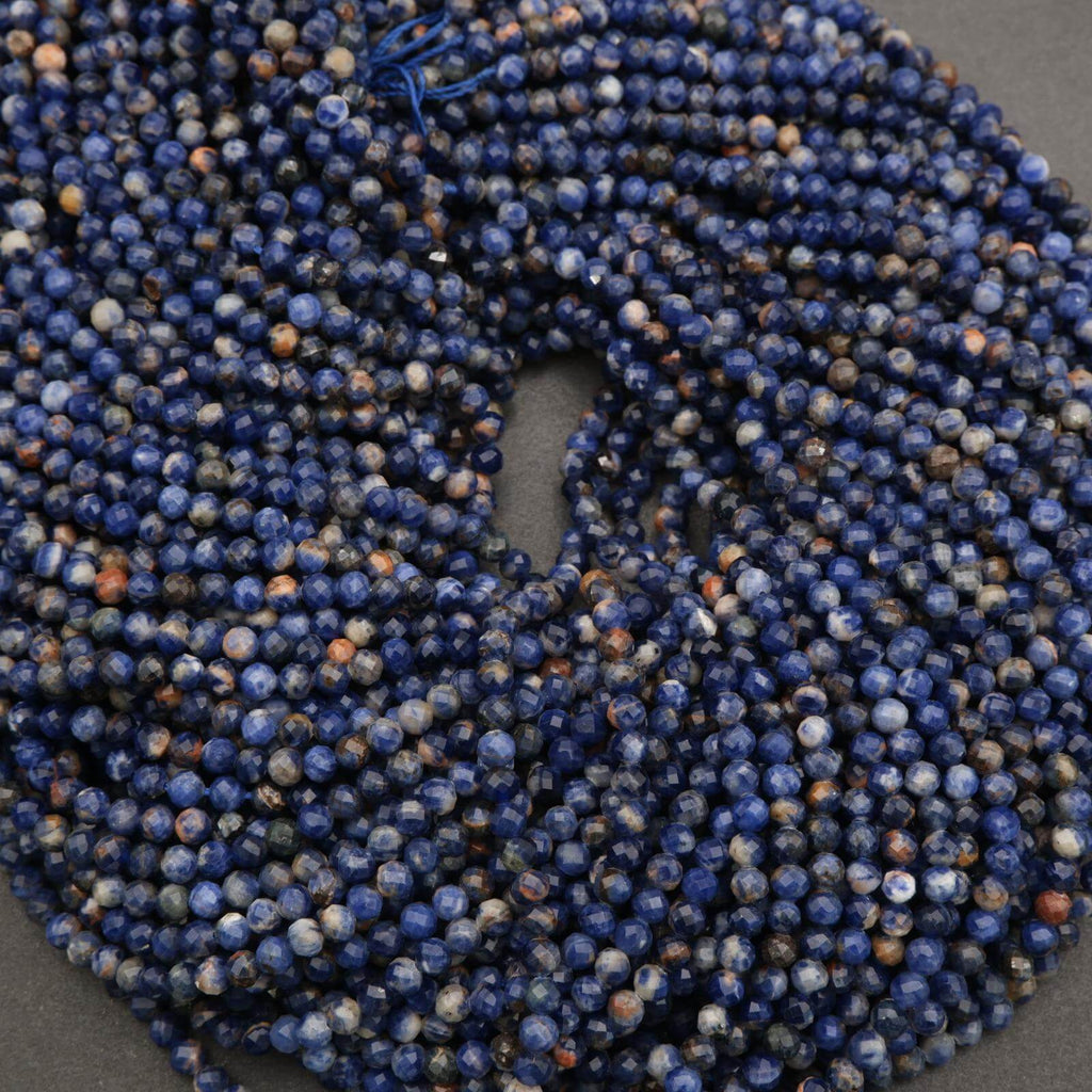 Close-up of a blue beaded scrunchie on a dark background