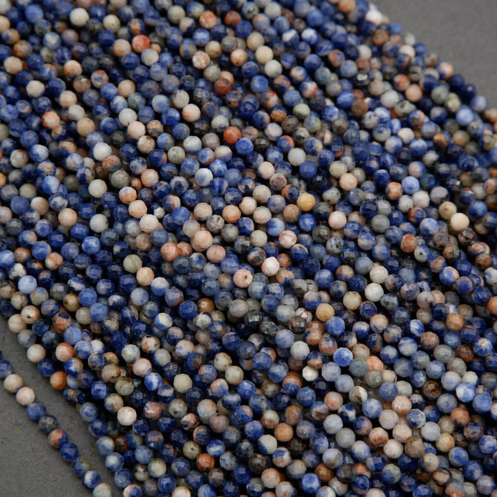 Orange, blue, and white, round faceted beads.