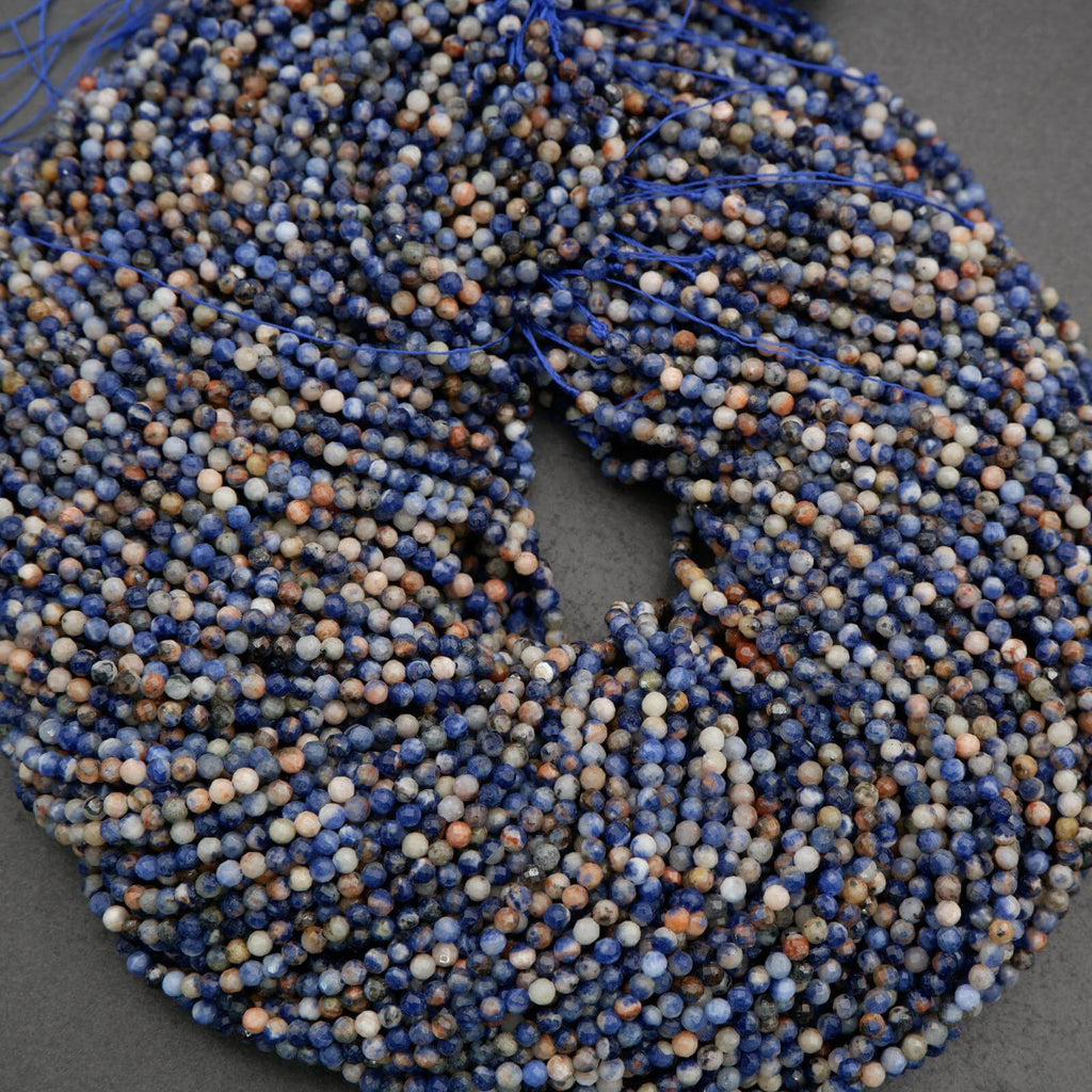 Orange, blue, and white, round faceted beads.