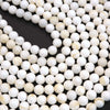 Close-up of white beads on a black background