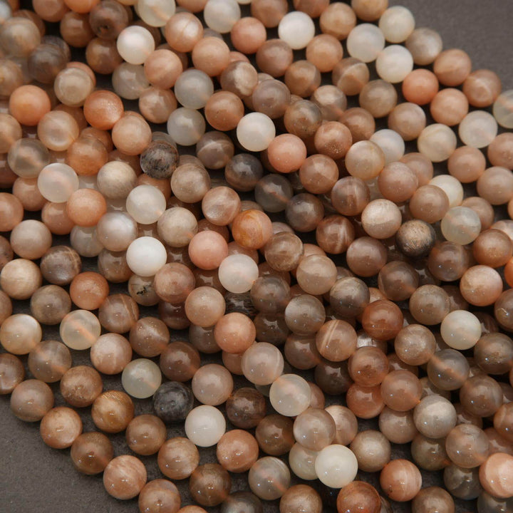Close-up of multicolored round beads on a gray background