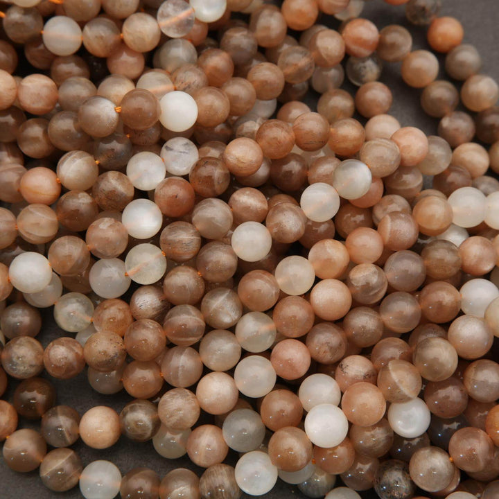 Close-up of multicolored round beads on a dark background
