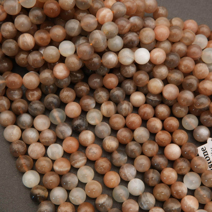 Close-up of multicolored round beads on a gray background