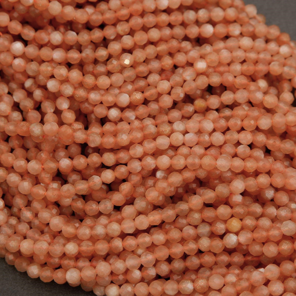 Close-up of a pile of small peach-colored beads