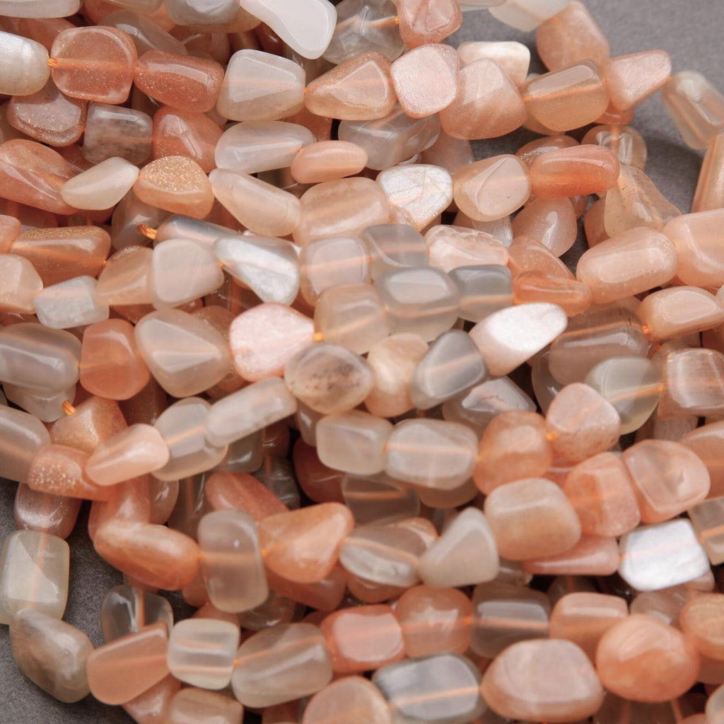 Close-up of pink and white pebbles on a gray background