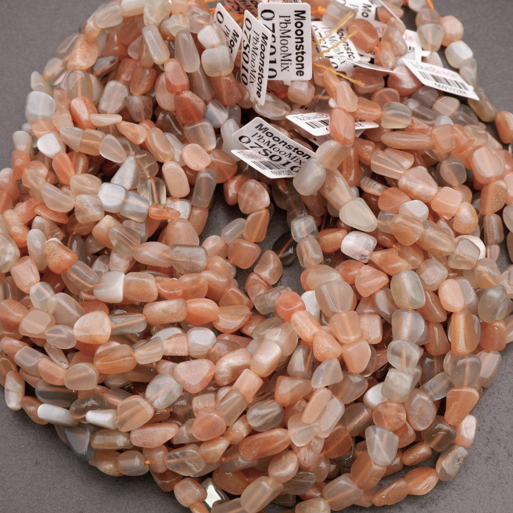 Necklace of small, multicolored stones with labels on a gray background