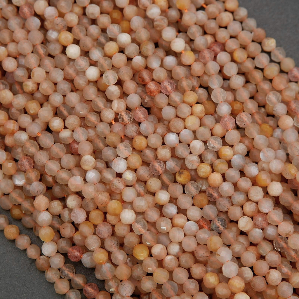 Close-up of small, round, beige-colored stones on a gray background