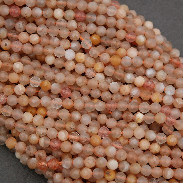 Close-up of round, multicolored beads on a gray background