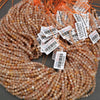 Close-up of beads with price tags on a gray background