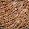 Close-up of small, round, multicolored beads.