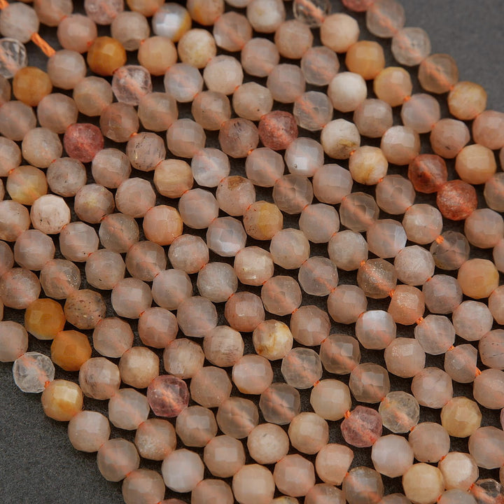 Close-up of small, round, multicolored beads on a dark background