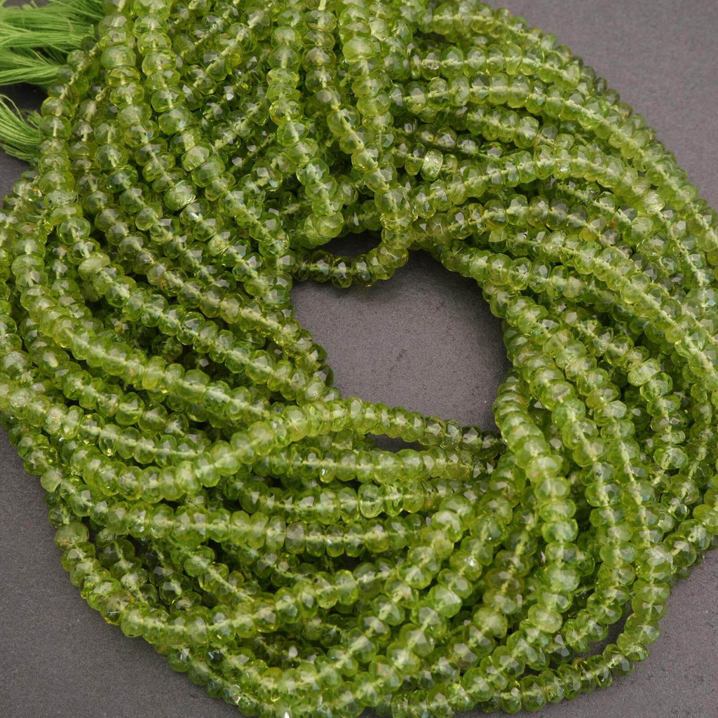 Green peridot beads on a gray background