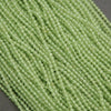 Close-up of green beads on a gray background