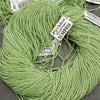 Green bead string with labels on a gray surface