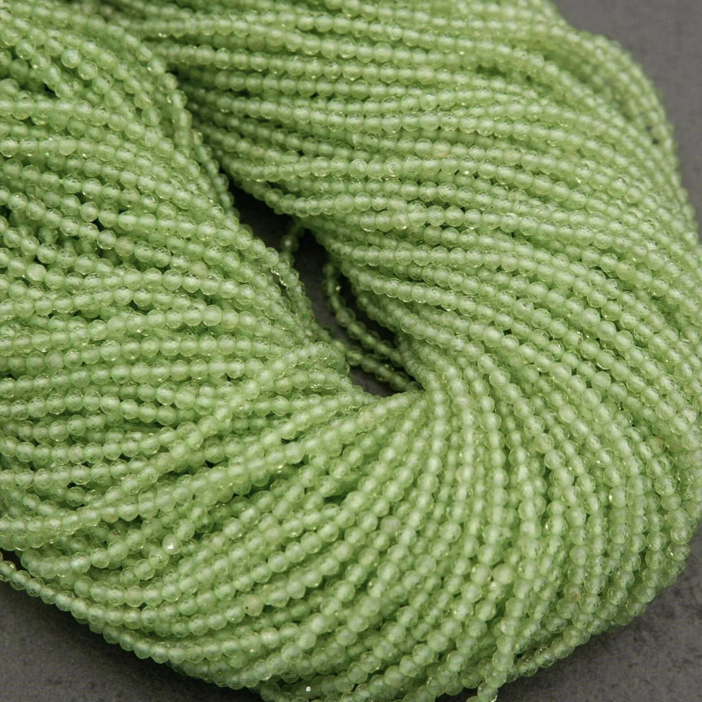 Close-up of a skein of green yarn on a dark background