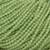Close-up of green beads arranged in a row
