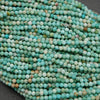 Sea green-blue faceted round beads.