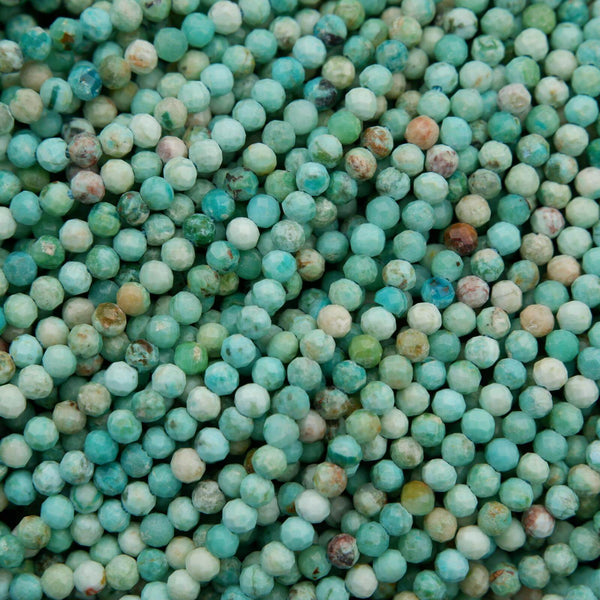 Sea green-blue faceted round beads.