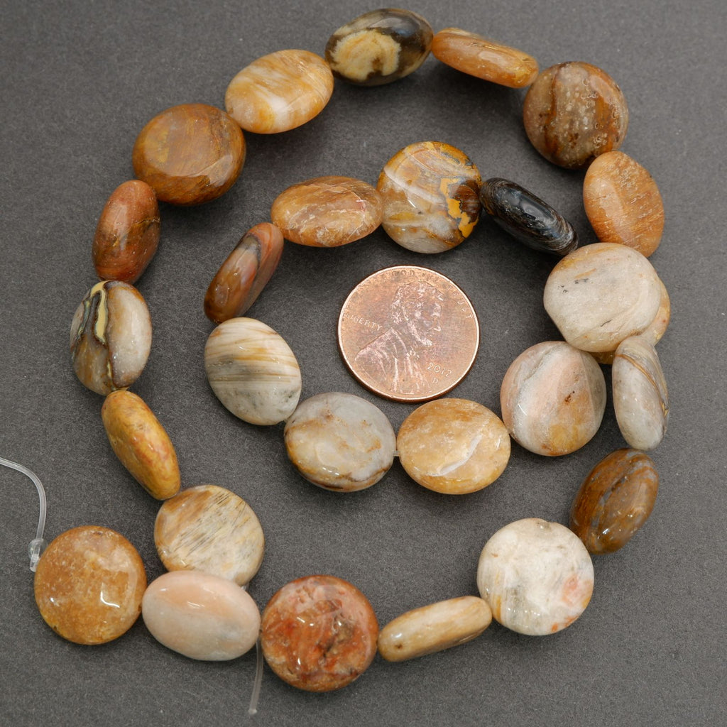 Close-up of polished earth-tone beads showing smooth finish and natural mineral variation.