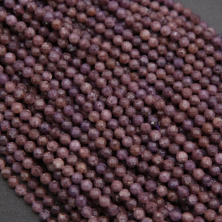 Close-up of purple beads on a dark background