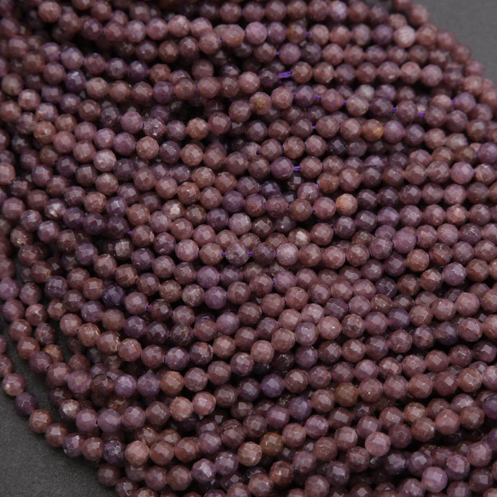 Close-up of a string of purple beads on a dark background