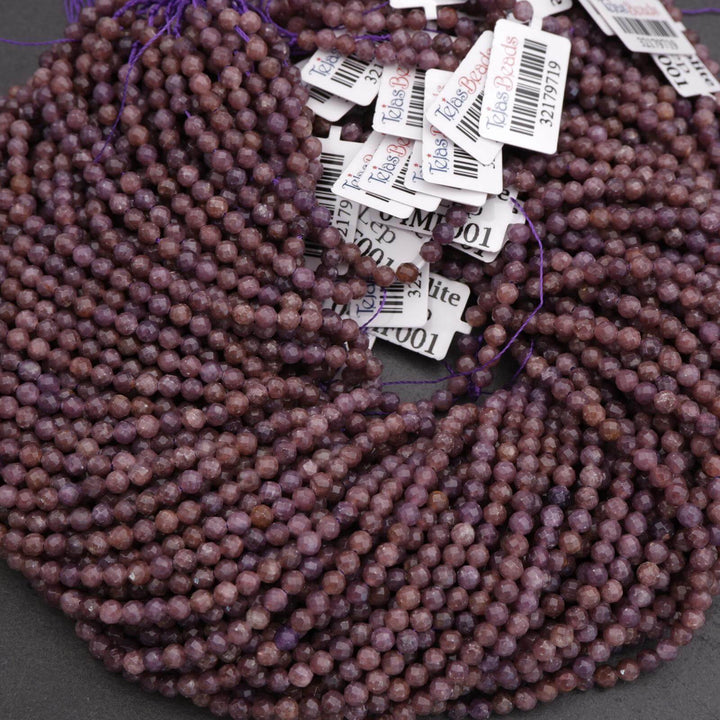 Purple beads with labels on a dark background