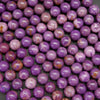 Vibrant purple phosphosiderite beads.