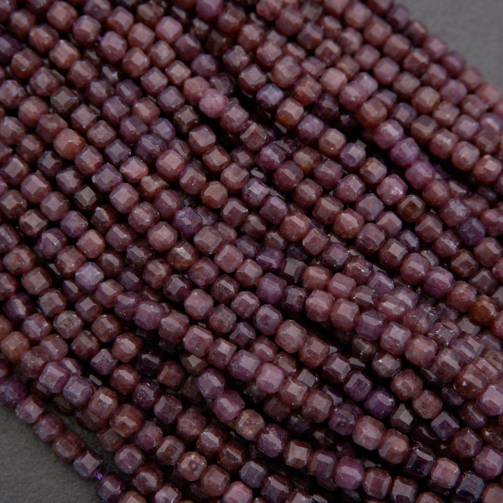 Close-up of purple beads on a gray background