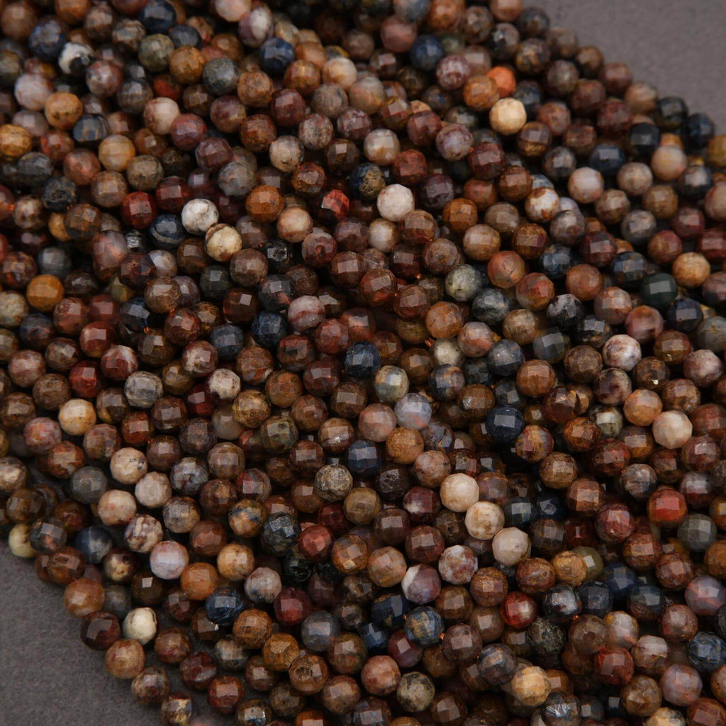 Close-up of multicolored beads on a gray background