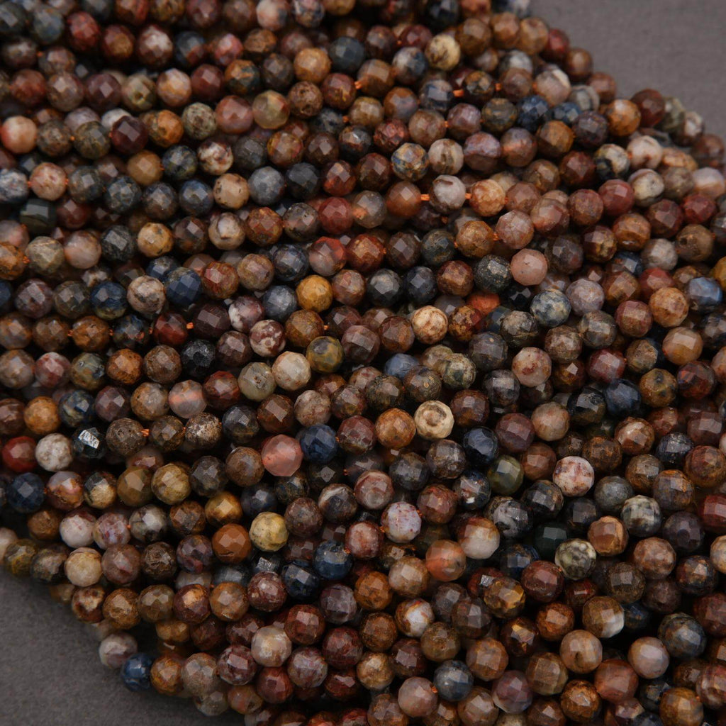 Close-up of multicolored gemstone beads on a dark background