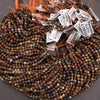 Multicolored beads with price tags on a gray background