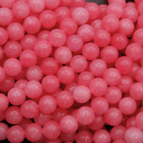 Pink jade round beads in bright and soft pink tones, polished