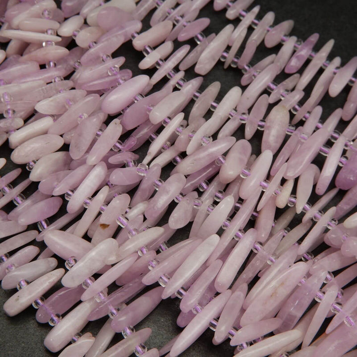 Pink kunzite stick shape beads.