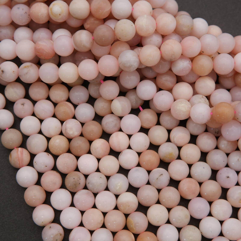 Close-up of pink and white beads on a dark background